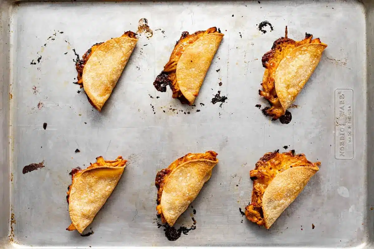 20-Minute Mini Tacos (Crispy Baked Chicken Tacos) 15 Crispy baked Mini Tacos straight from the oven on a baking sheet