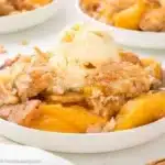 Peach Cobbler with Cake Mix 19 Bisquick Peach Cobbler served on a plate with a scoop of ice cream